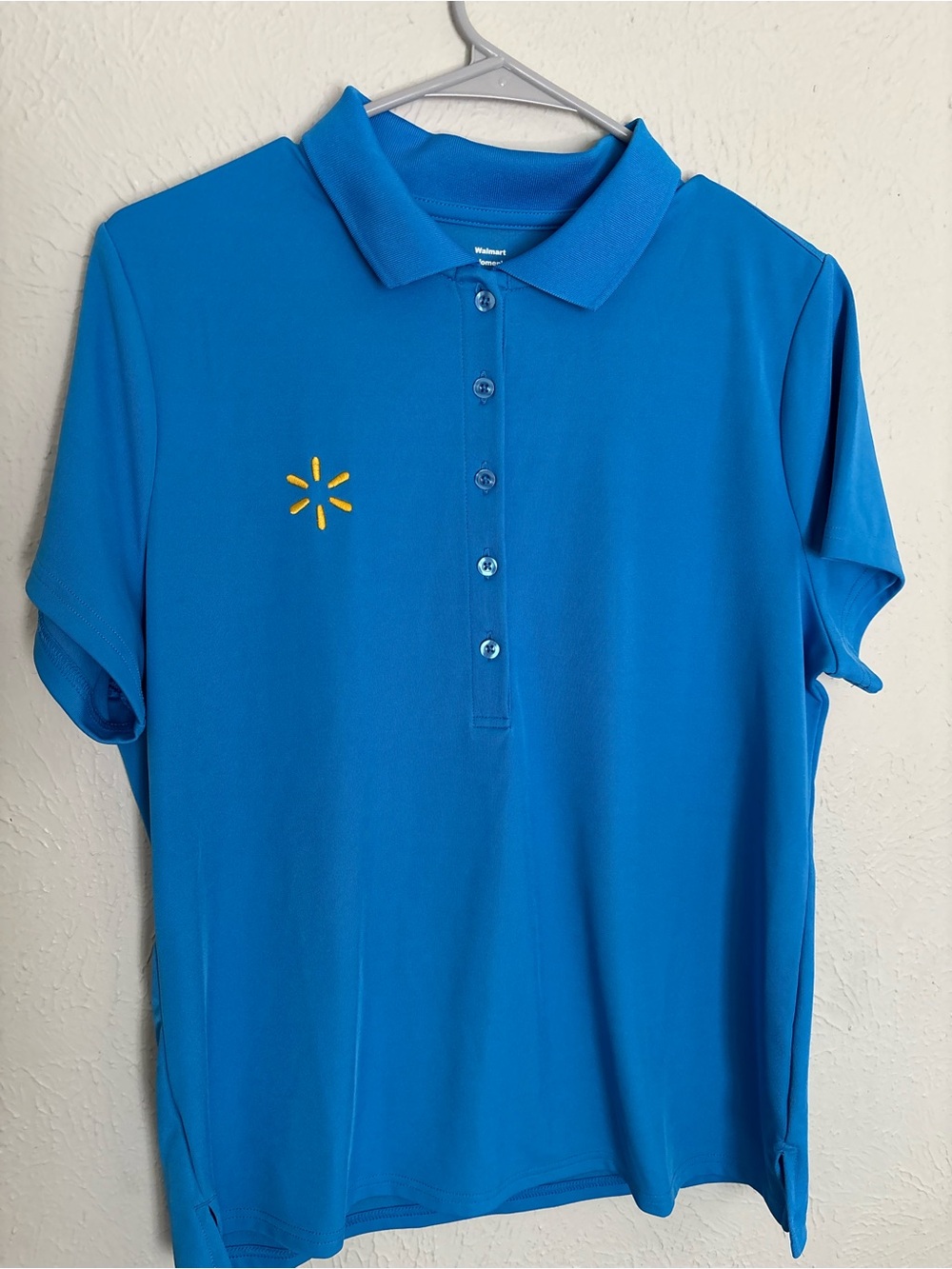 Women’s Blue Polo Shirt with Embroidered Yellow Logo